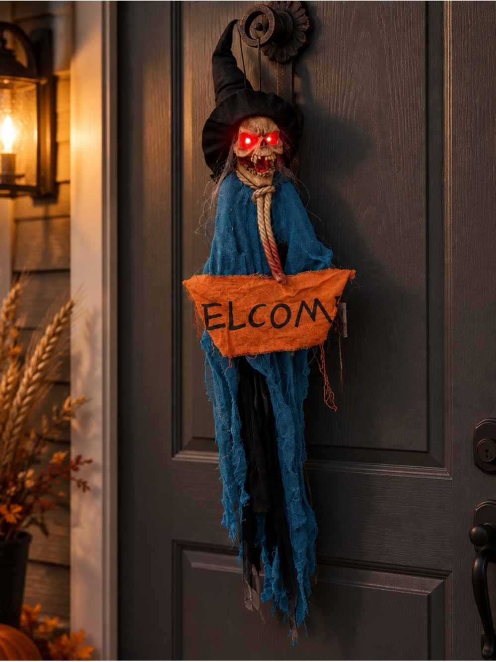 Halloween Skeleton Welcome Door Hanger in Blue and Orange. eyes light up/sound!